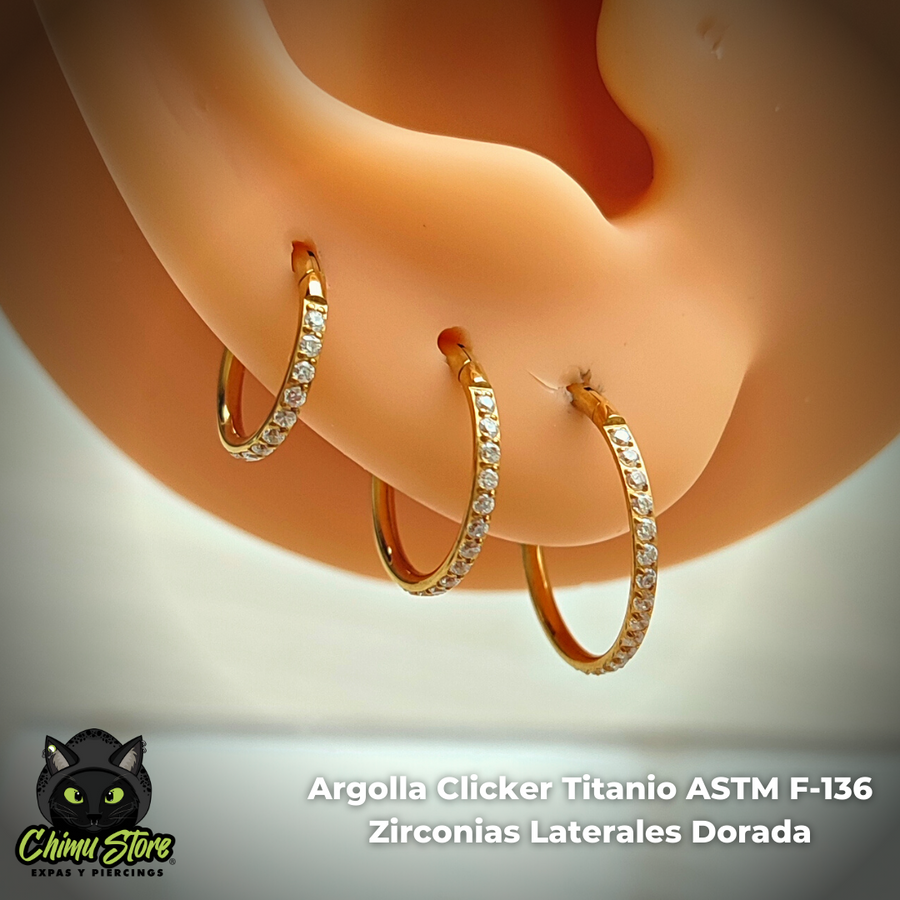 Argolla Clicker Titanio ASTM F-136 - Zirconias Laterales Dorada (1,2mm) (16G)